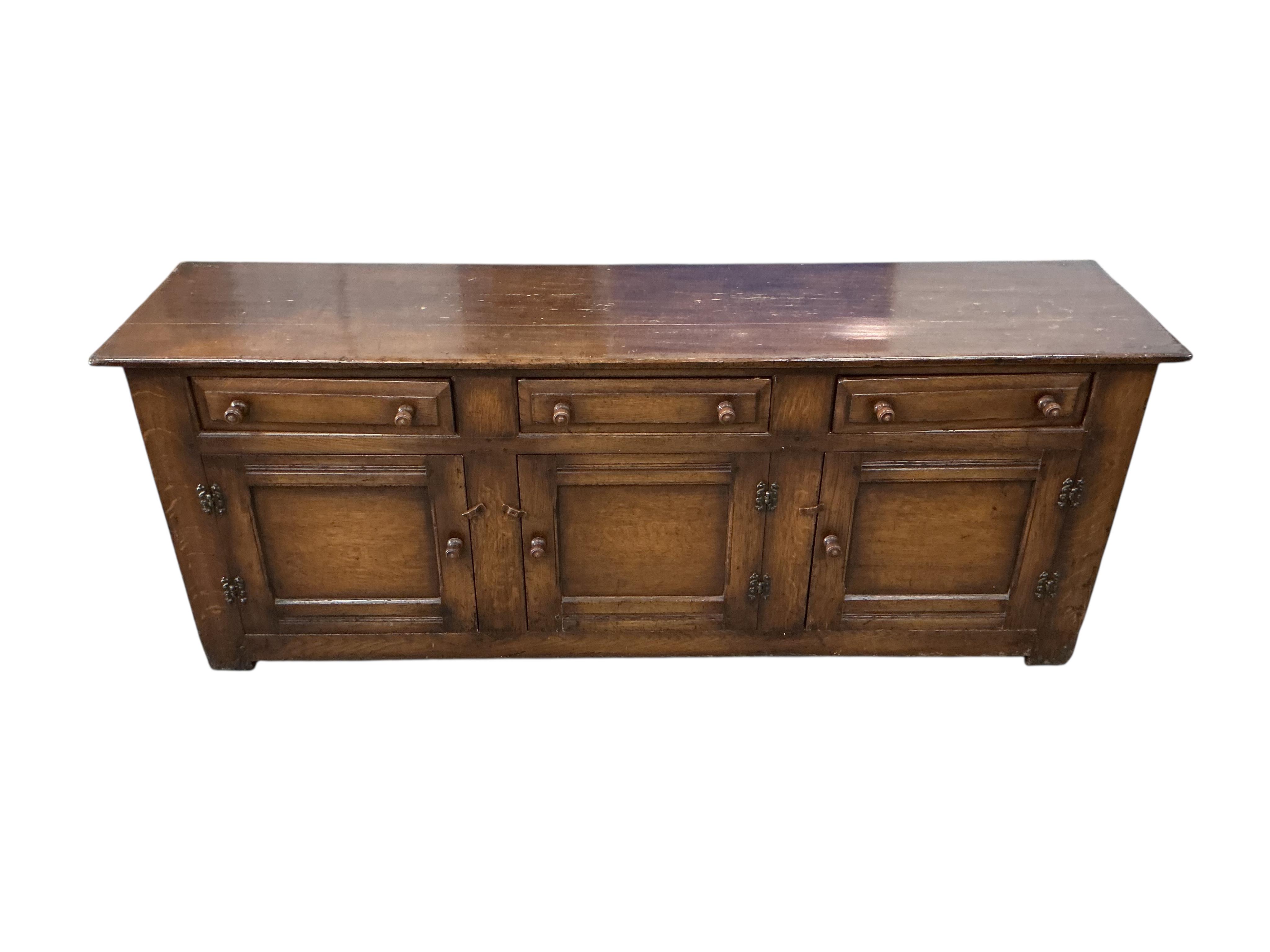 A reproduction 18th century style oak low dresser, width 198cm, depth 48cm, height 76cm
